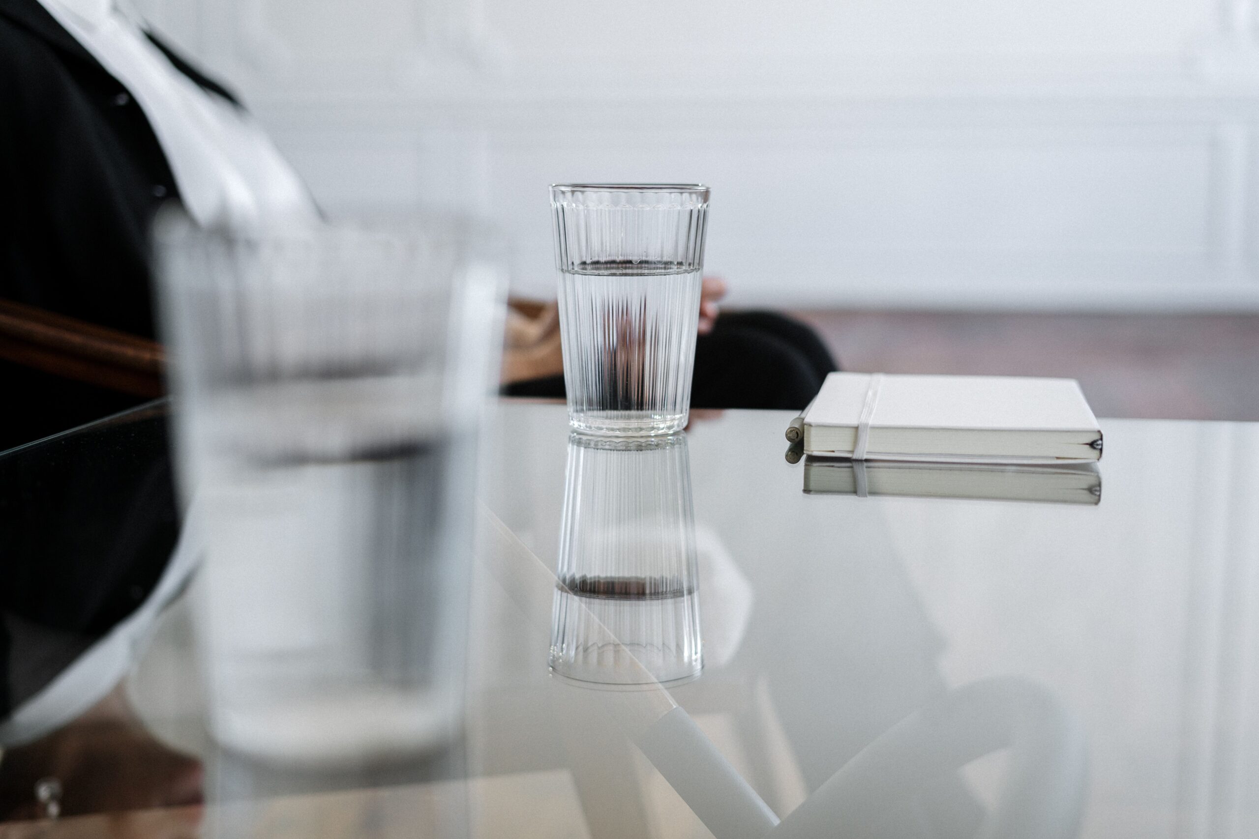 glass of fresh cold filtered water in the workplace