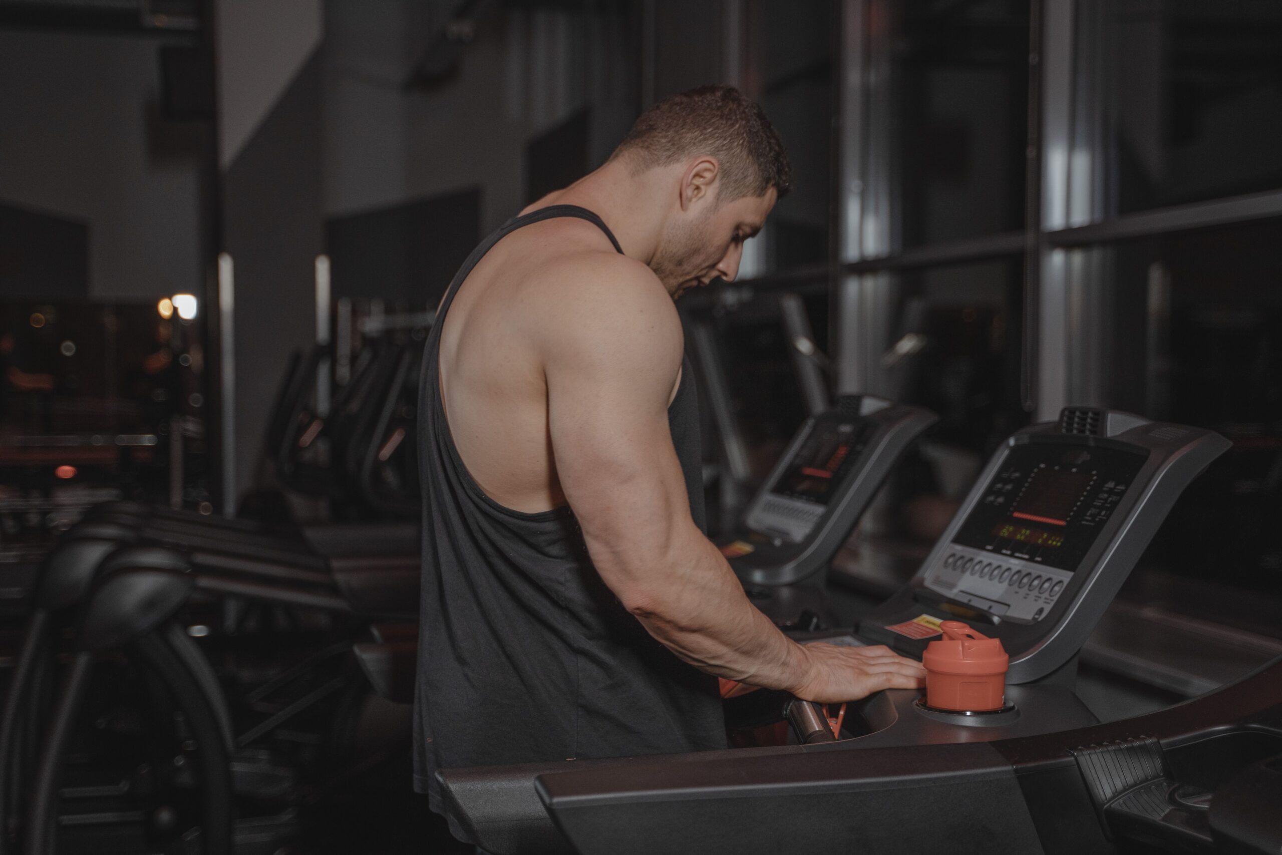working out at the gym with water bottle nearby